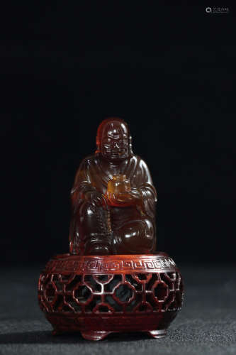 A DHARMA DESIGN AMBER ORNAMENT