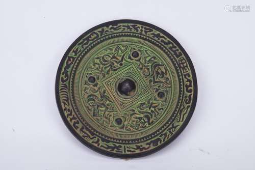 A CHINESE BRONZE MIRROR