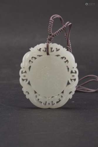 A Chinese carved white jade pendant