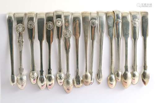 Assorted patterns:-sixteen various pairs of sugar tongs to include fiddle