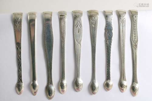 Fully marked & bright-cut:-nine various george iii pairs of sugar tongs (some