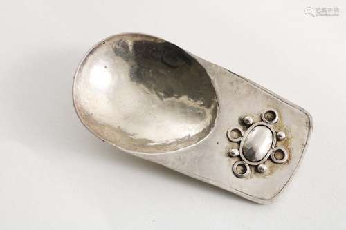 An arts & crafts handmade caddy spoon