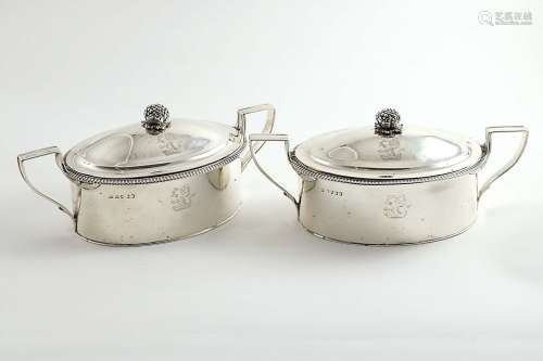A pair of george iii two-handled covers and fruit finials
