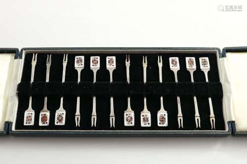 A late 20th century cased set of twelve cocktail sticks