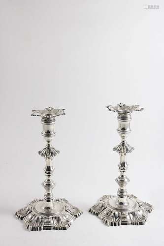 A pair of george ii cast candlesticks