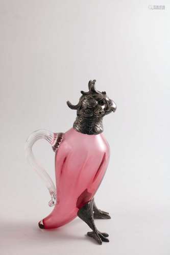 A late victorian electroplated mounted glass decanter or jug in the form of a