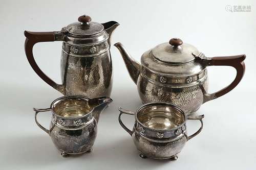 An arts & crafts matched four-piece tea set
