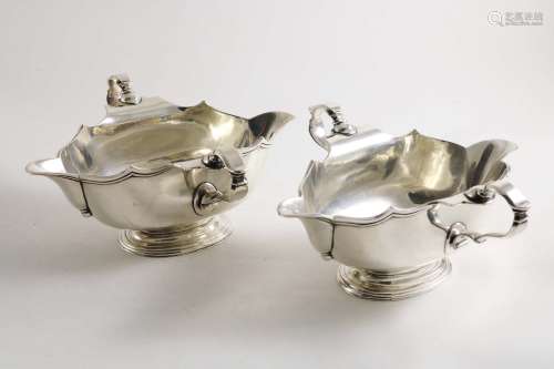 A pair of early 20th century double-lipped sauce boats