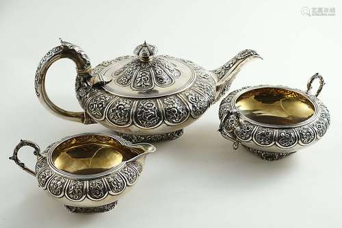 A matched three-piece tea set