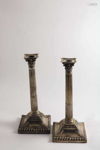 A pair of george iii column candlesticks