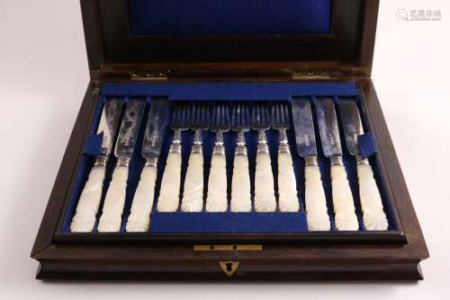 A victorian cased set of twelve pairs of dessert knives & forks with carved,