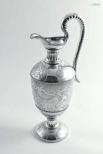 A victorian engraved hot water jug or ewer