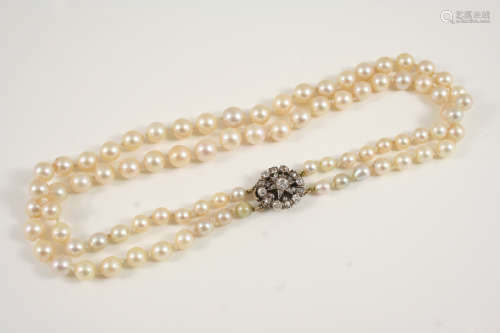 A two row graduated cultured pearl and diamond choker necklace