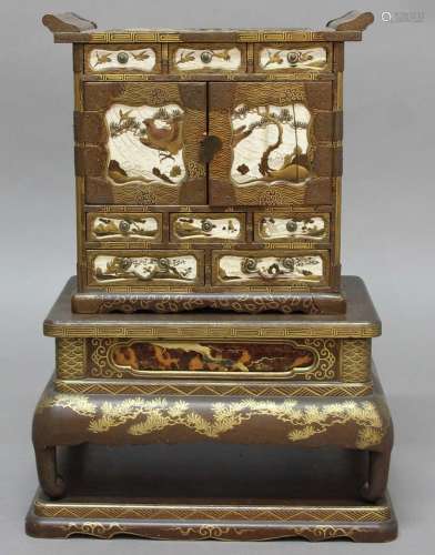 Japanese ivory, tortoiseshell and lacquer table cabinet, stand and base,the