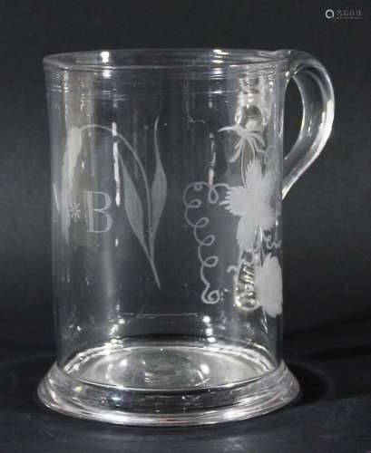 English glass tankard,18th century, with a moulded rim and flared foot, the