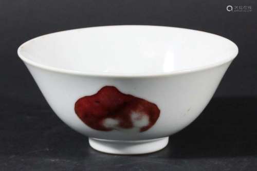 Chinese footed bowl,copper red decorated with a pomegranate and two peaches,