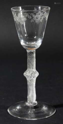 English wine glass,circa 1750, the rounded funnel bowl engraved with a border