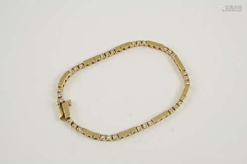 A diamond and gold bracelet