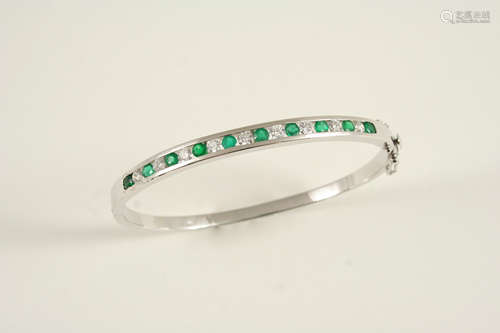 An emerald and diamond half hinged bangle