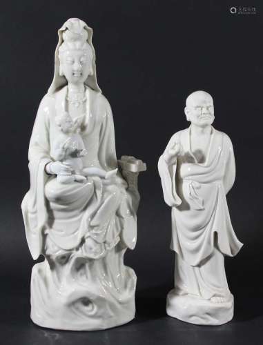 Chinese blanc de chine figure of guanyin and a child,ming style, seated with a