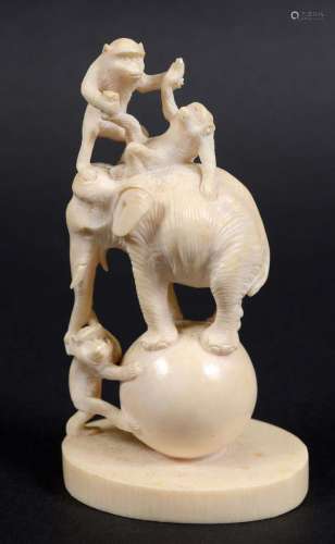 Japanese ivory okimono,meiji, carved as an elephant and three monkeys balancing
