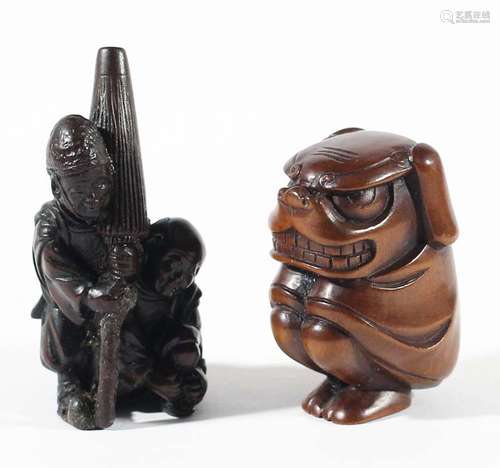 Two japanese wooden netsuke,one carved as two men, one carrying a large