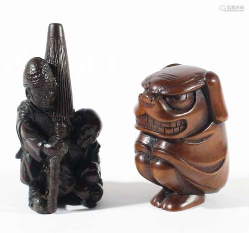 Two japanese wooden netsuke,one carved as two men, one carrying a large
