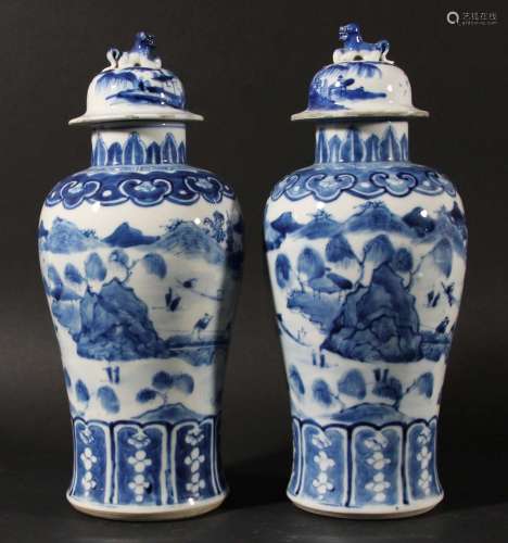 Pair of chinese blue and white baluster vases and covers,kangxi style but