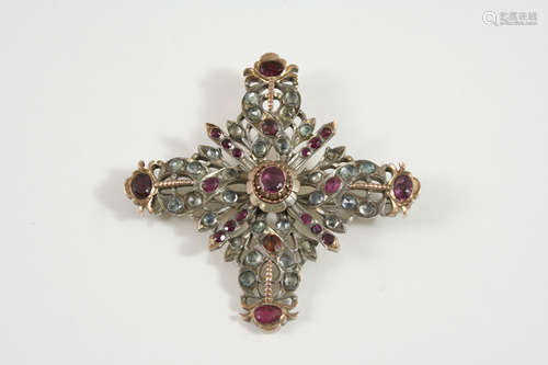 A continental quatrefoil garnet set brooch