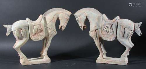 Pair of chinese 'jade' horses,tang style, carved with heads slightly turned,