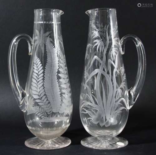 Near pair of glass jugs,