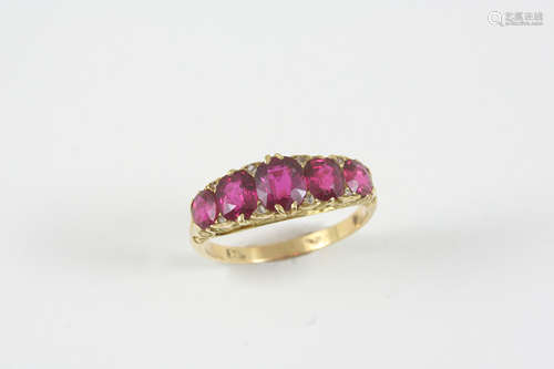 A ruby and diamond half hoop ring