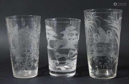 Three similar glass tumblers,