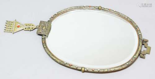 Japanese brass oval mirror,late 19th century, the bevelled glass inside a frame