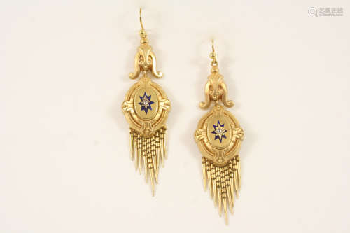 A pair of gold drop earrings