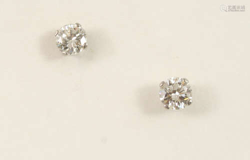 A pair of diamond stud earrings