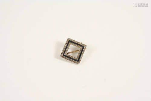 A diamond and black onyx brooch
