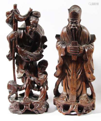 Group of four chinese wooden figures,late 19th or early 20th century, with