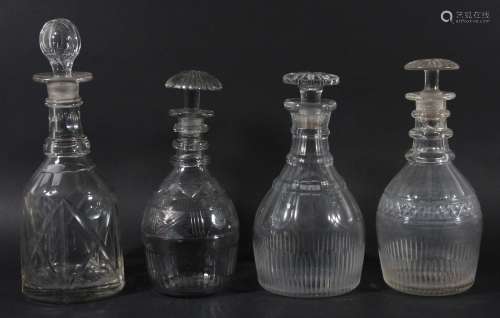 Group of four glass decanters and stoppers,19th century, of mallet forms, with