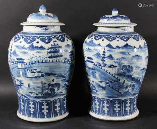 Pair of chinese blue and white vases and covers,kangxi style but 19th century,
