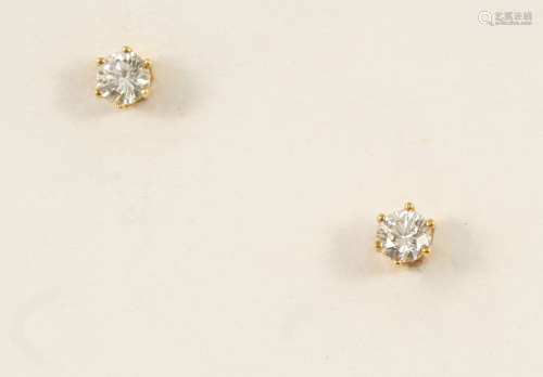 A pair of diamond stud earrings