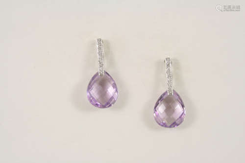 A pair of amethyst and diamond drop earrings