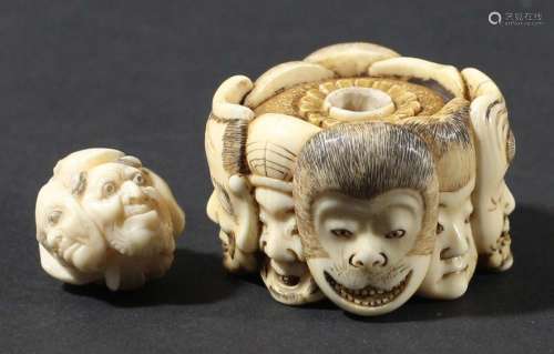 Japanese ivory netsuke,19th century, carved with eight masks including a