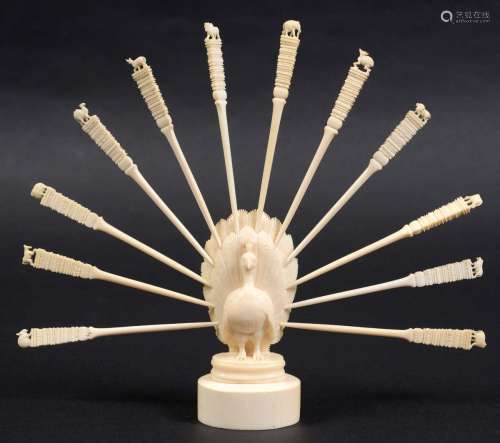 Indian ivory tooth pick holder,19th century, carved as a peacock with its tail
