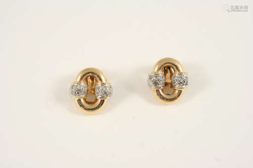 A pair of gold and diamond clip earrings