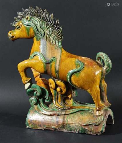 Chinese sancai ridge tile,modelled as a leaping horse supported by a scrolling