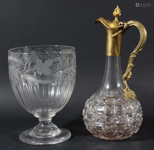 Gilt metal mounted claret jug,of globe and shaft form, the handle formed as