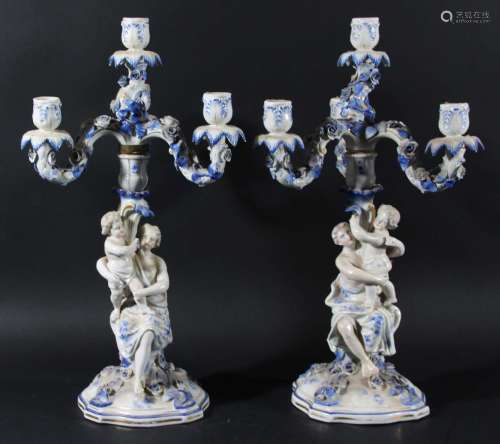 Pair of sitzendorf four light candelabra,modelled as a classical maiden and