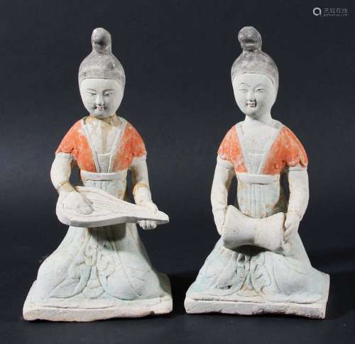 Two chinese pottery tomb figures,probably han dynasty, modelled as a girl,