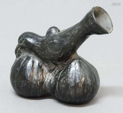 Pre-columbian style bird whistle,chimu style, modelled as a bird on two small